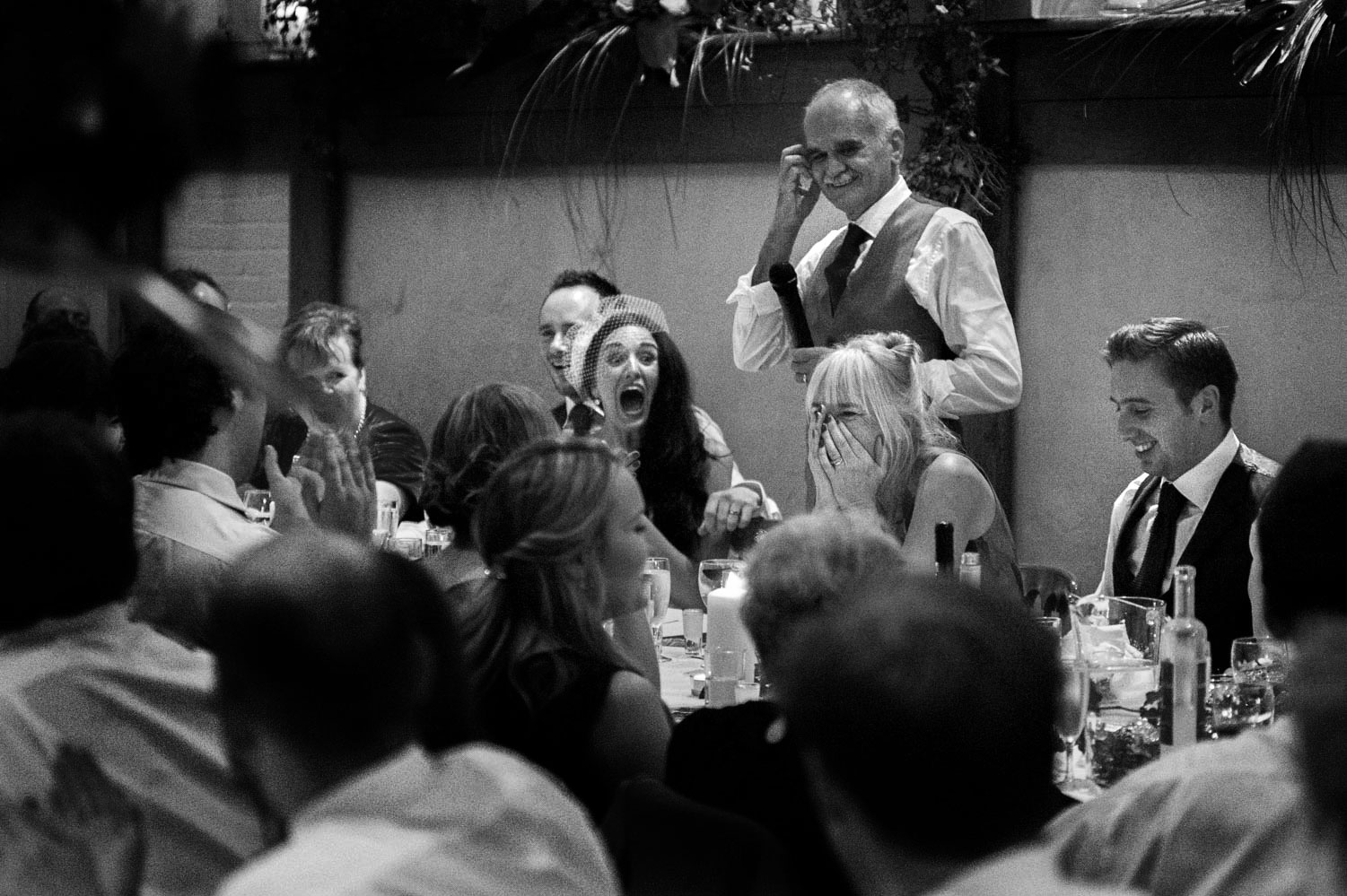 Wedding speeches at Pangdean Old Barn wedding reception by Brighton documentary wedding photographer James Robertshaw 