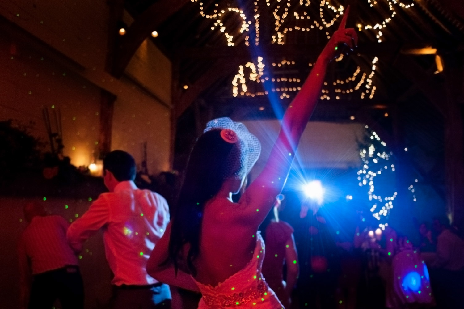 Bride on the dancefloor at Pangdean Old Barn wedding reception by Brighton documentary wedding photographer James Robertshaw 