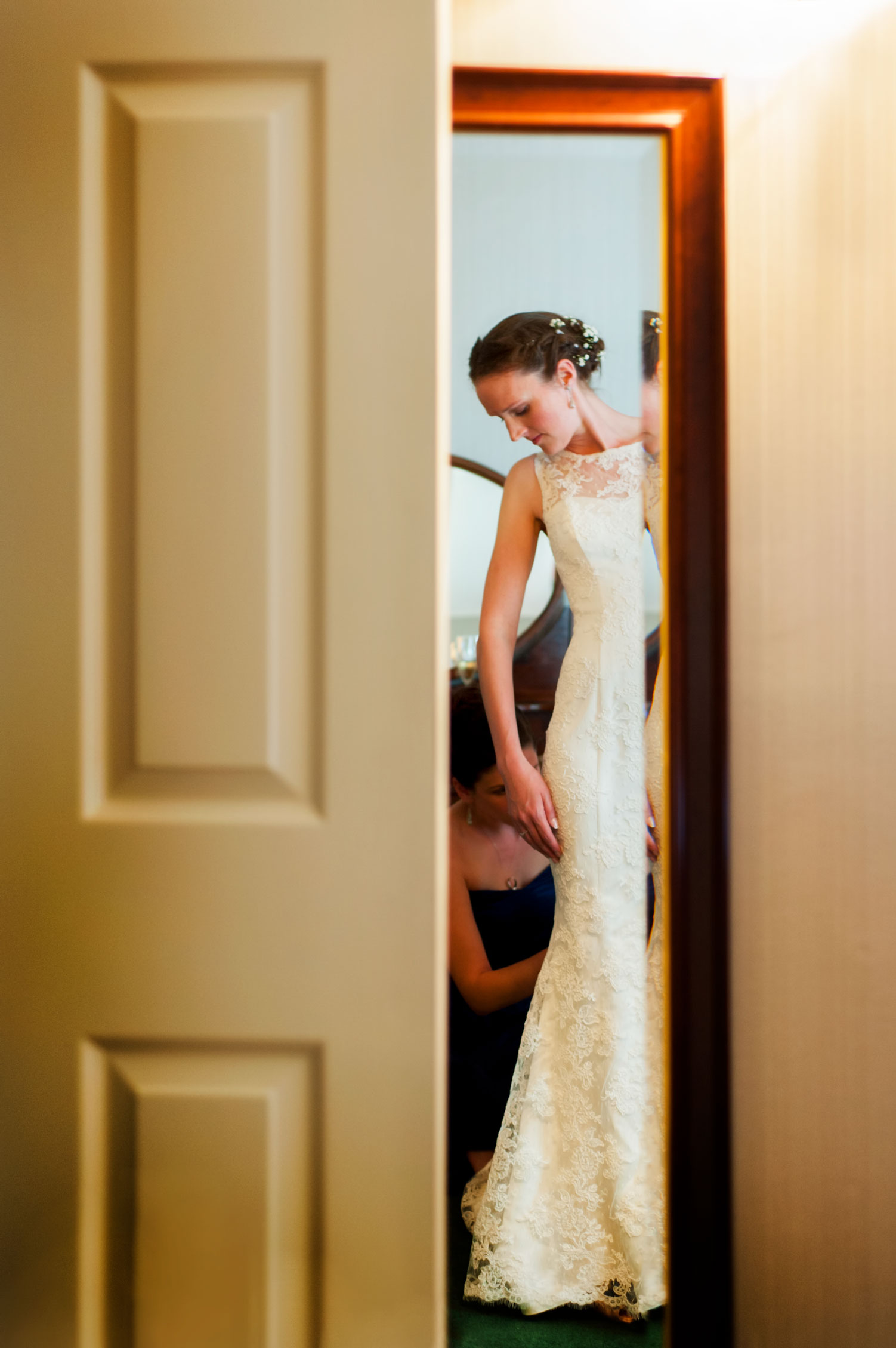 Bride in mirror by Sussex reportage photographer James Robertshaw