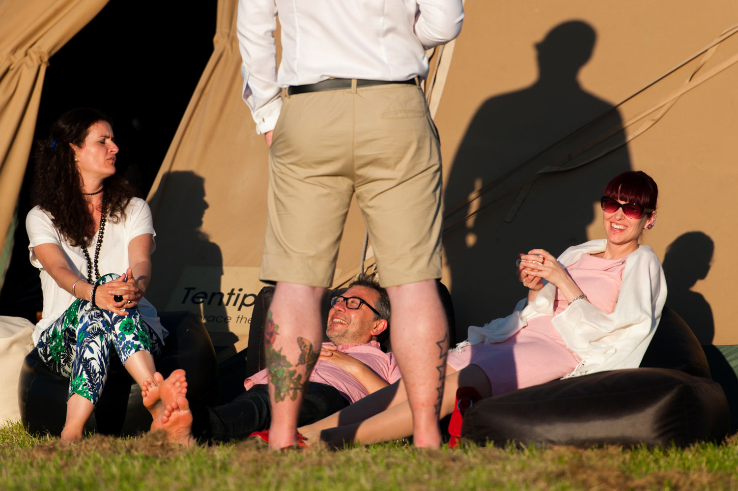 Wedding guests chatting outdoors in summer 