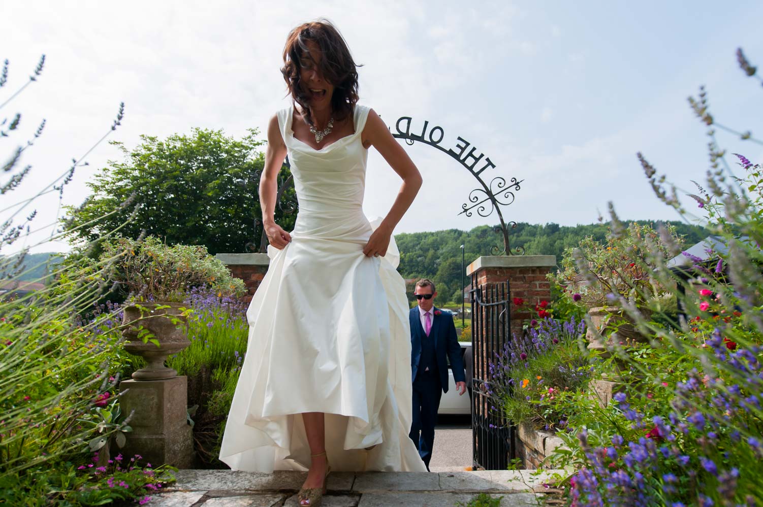 Bride and groom walking into the Old Rectory by Hastings wedding photographer James Robertshaw