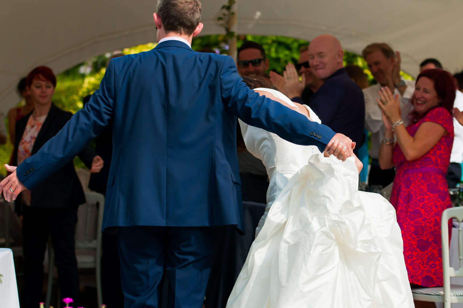 Bride and groom taking a bow at Ole Rectory wedding reception