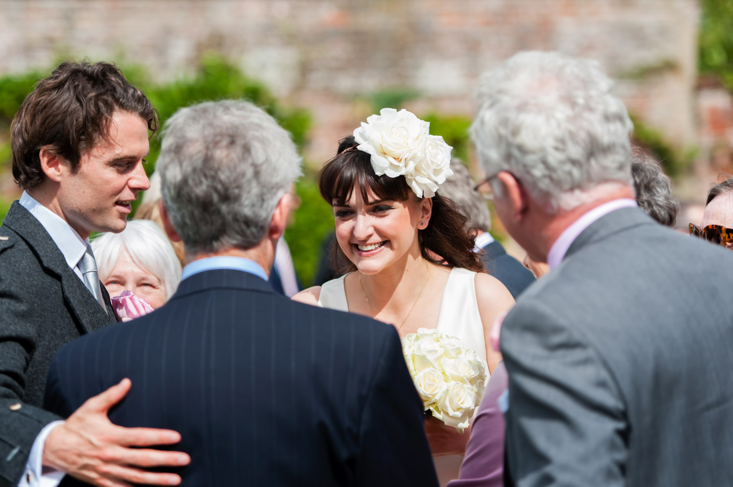 Bride smiling with guests