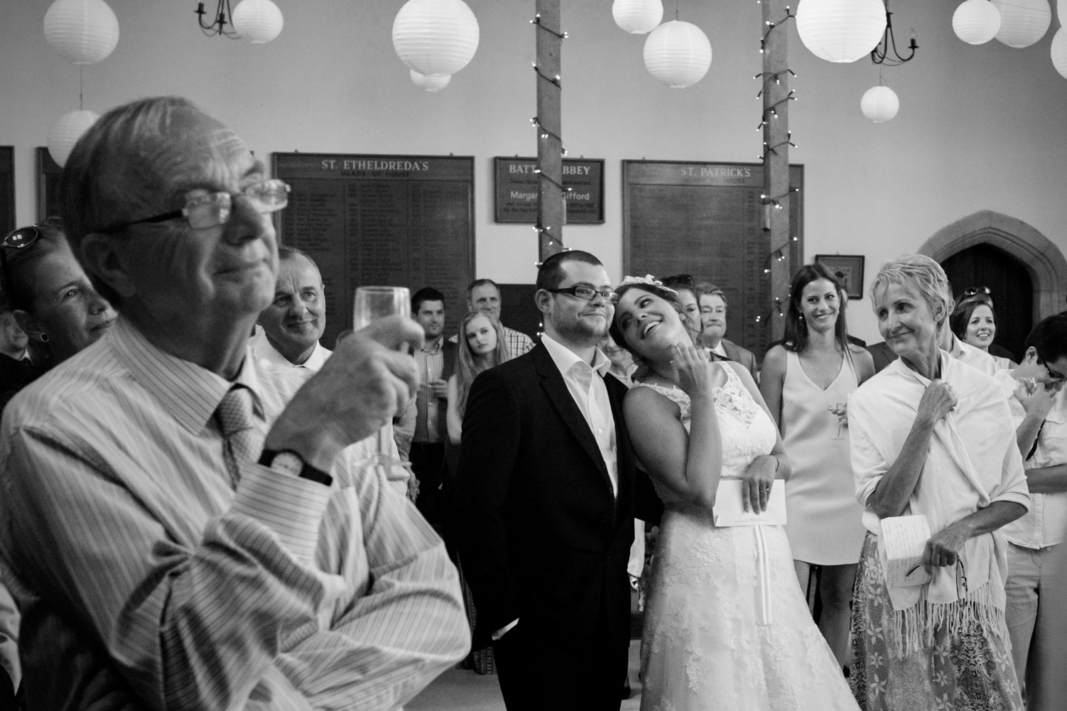 Bride tilting head and smiling at groom