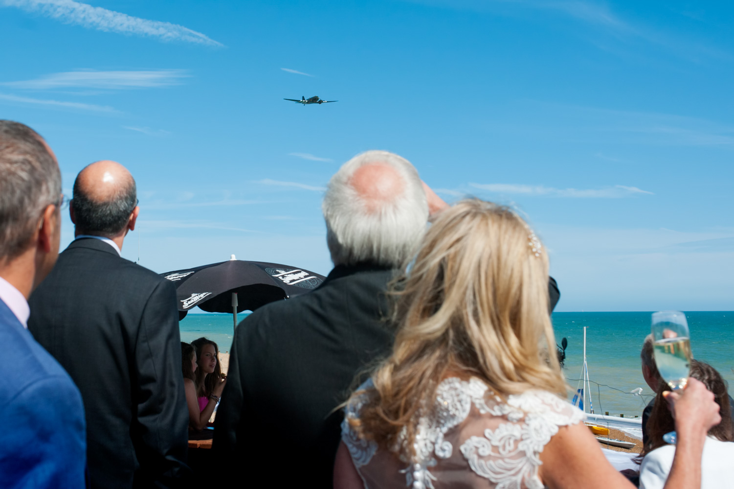 Dakota flying over wedding party