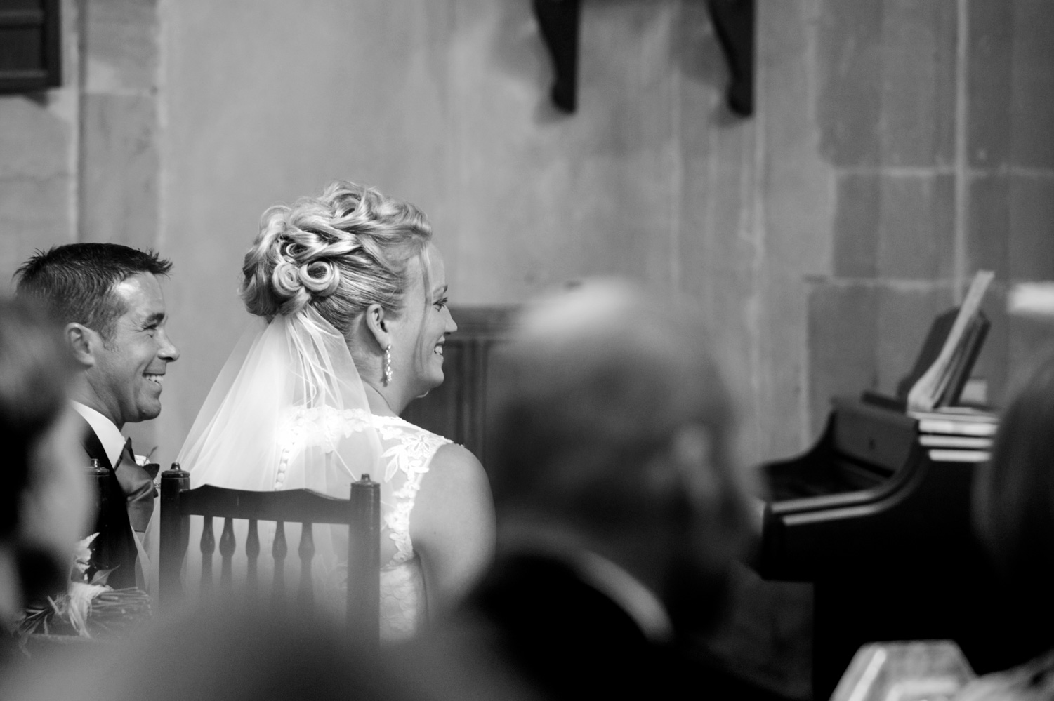 Bride and groom smiling during wedding ceremony