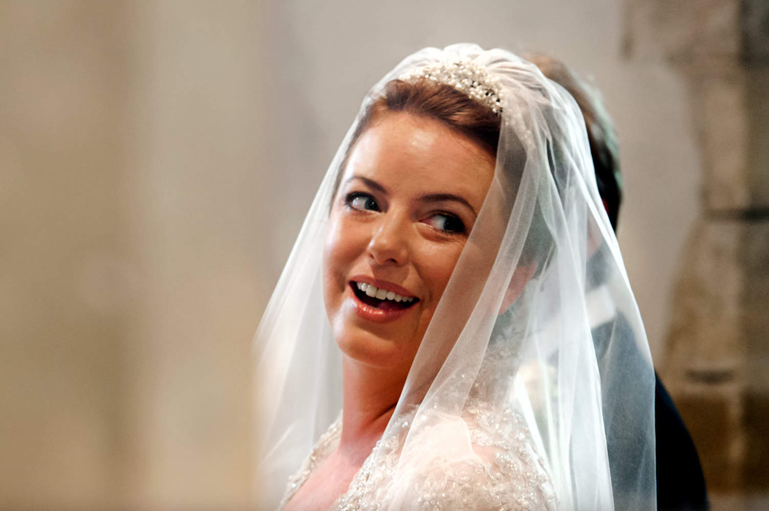 Bride smiling in church 