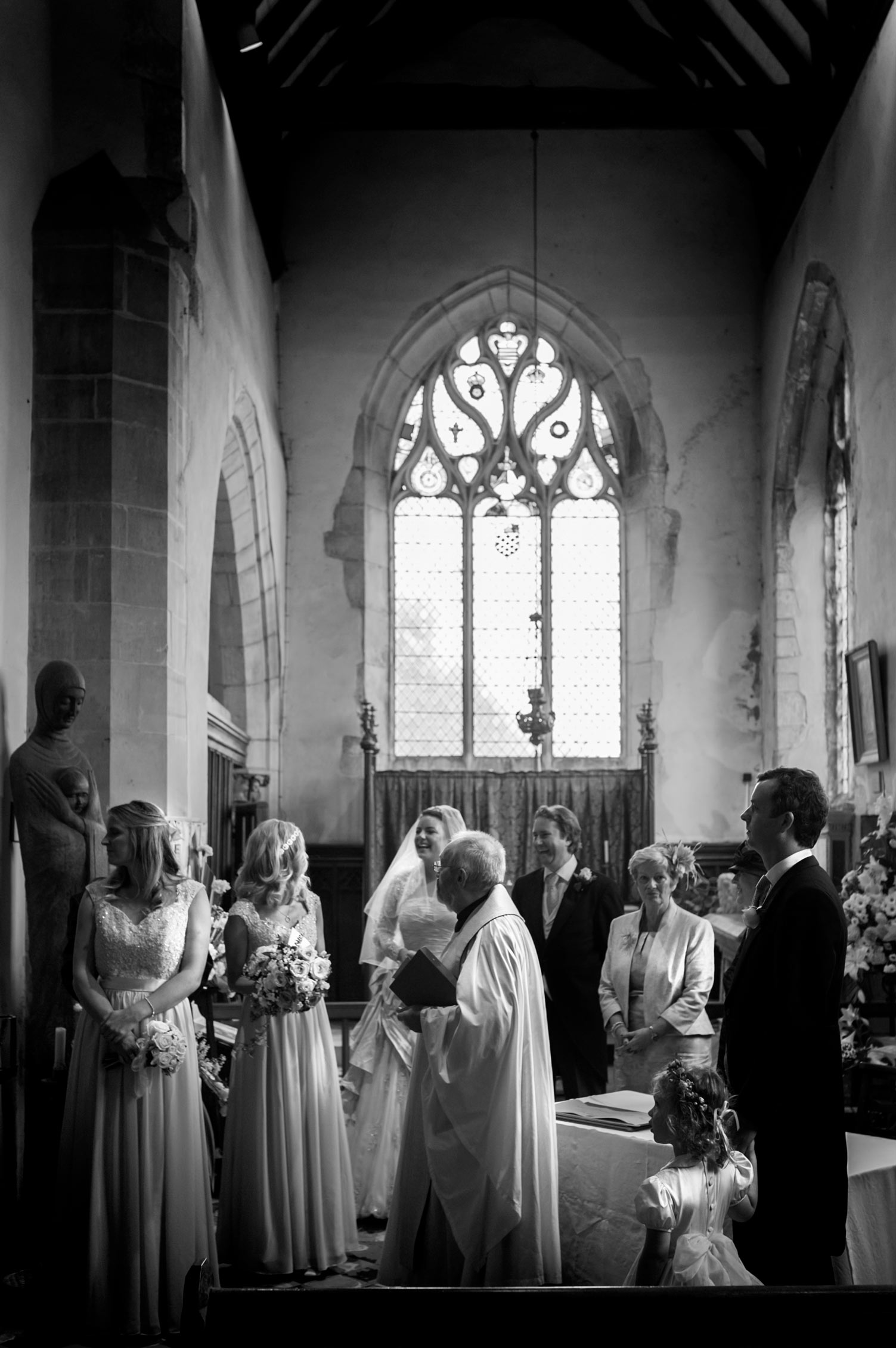 Bridal party after ceremony in church by east Sussex wedding photographer James Robertshaw