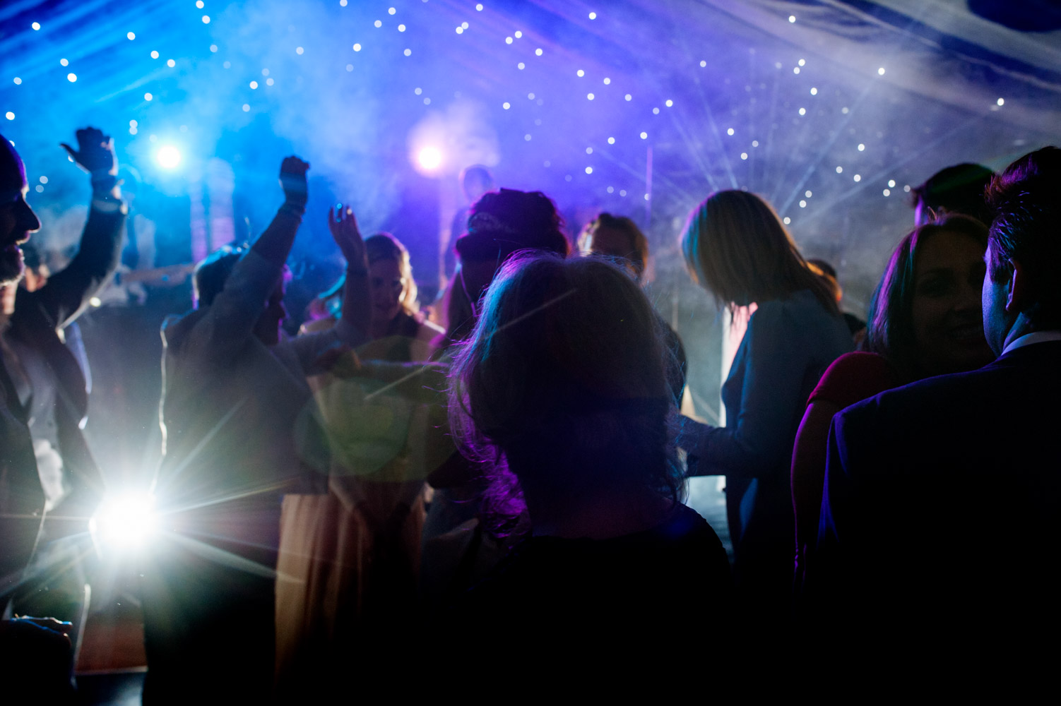 Weedding party dancing in a marquee