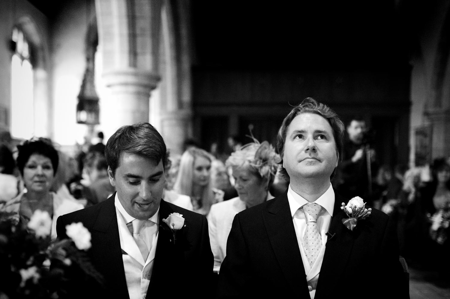 Groom looking up in church by east Sussex wedding photographer James Robertshaw