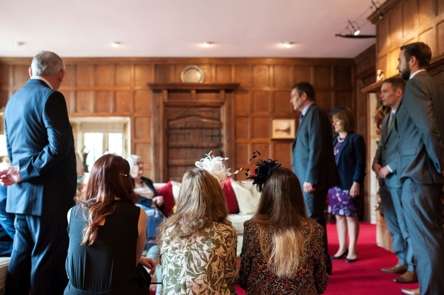 Wedding guests chatting before ceremony 