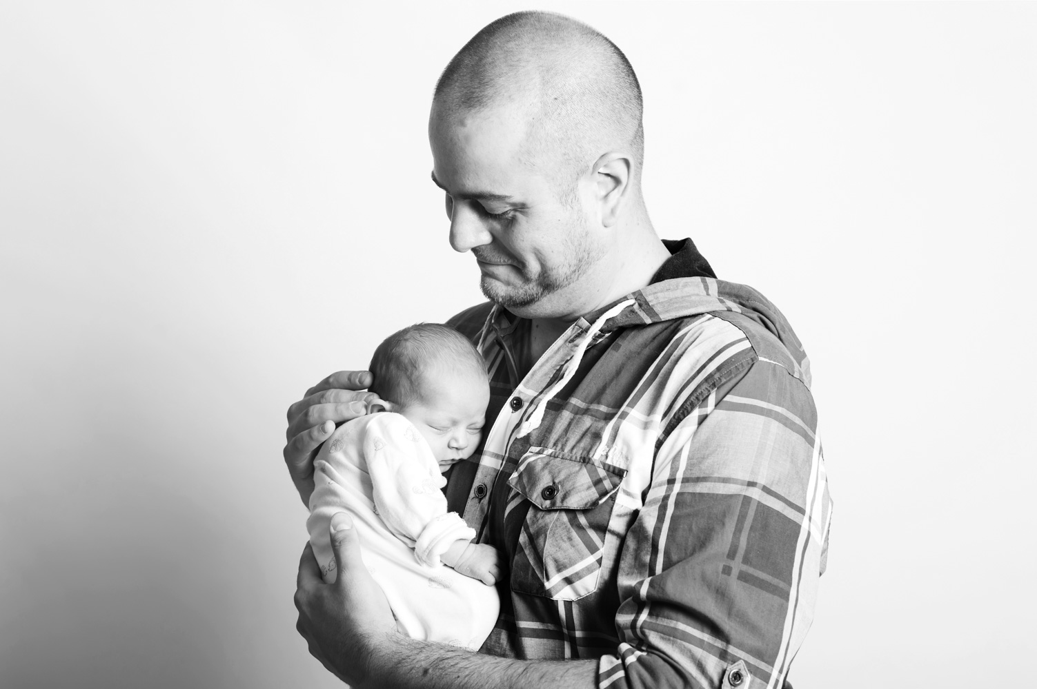 Father and baby by Sussex portrait photographer James Robertshaw