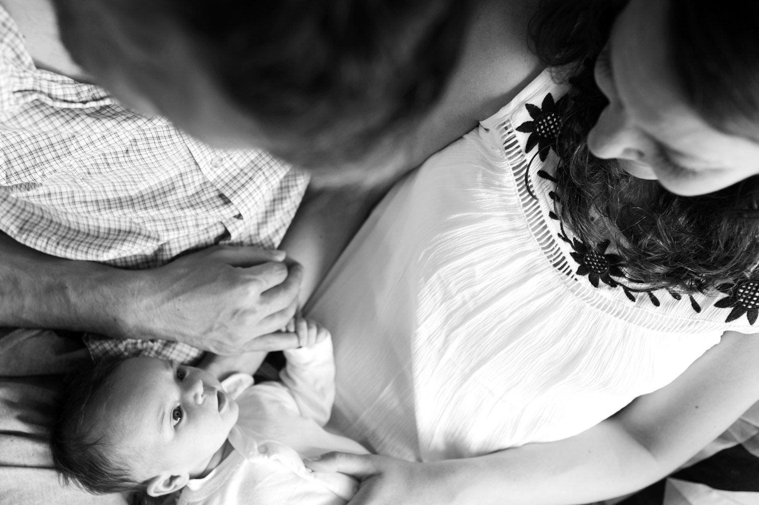 Parents with baby on sofa