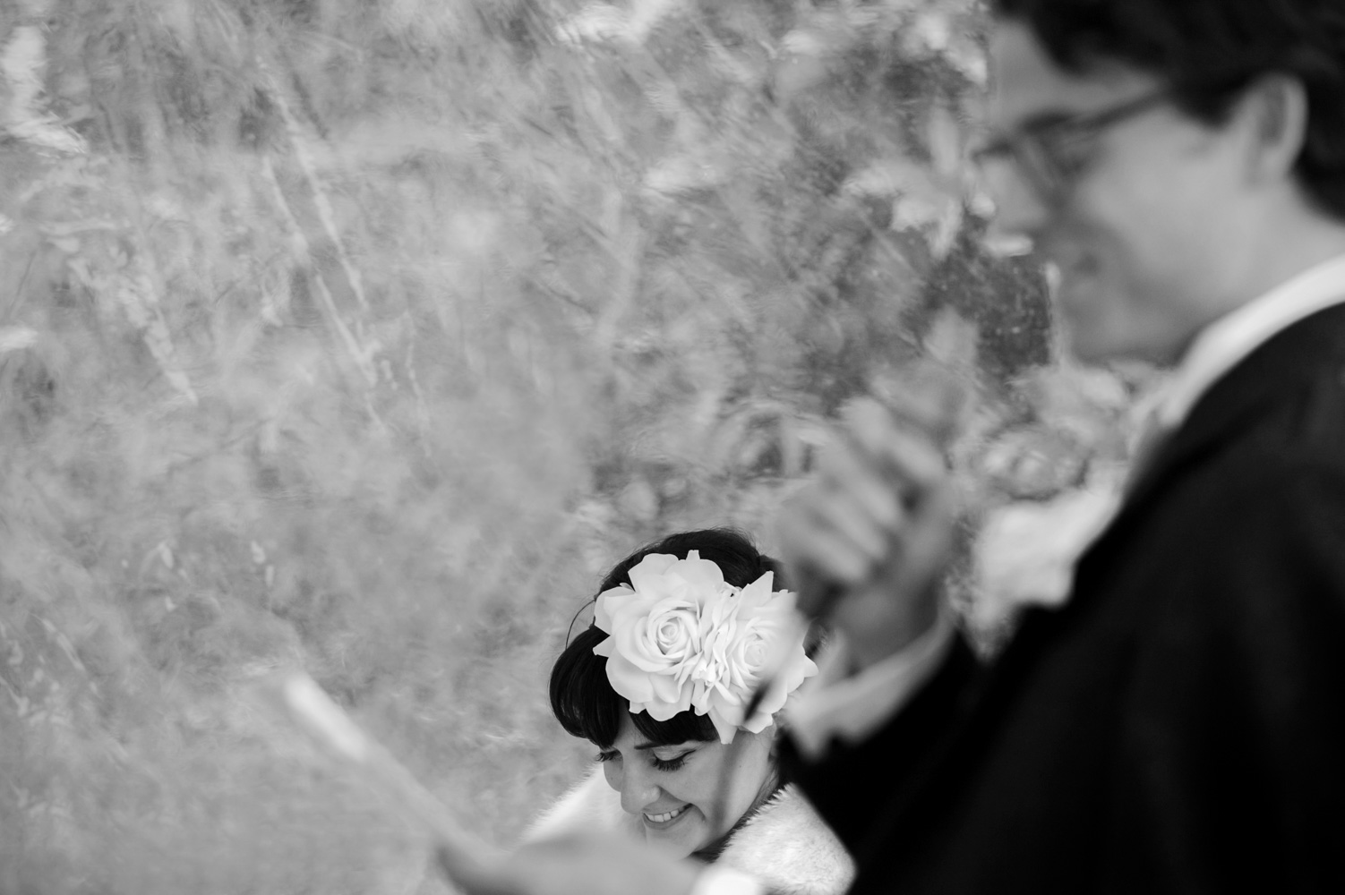 Bride smiling during groom speech