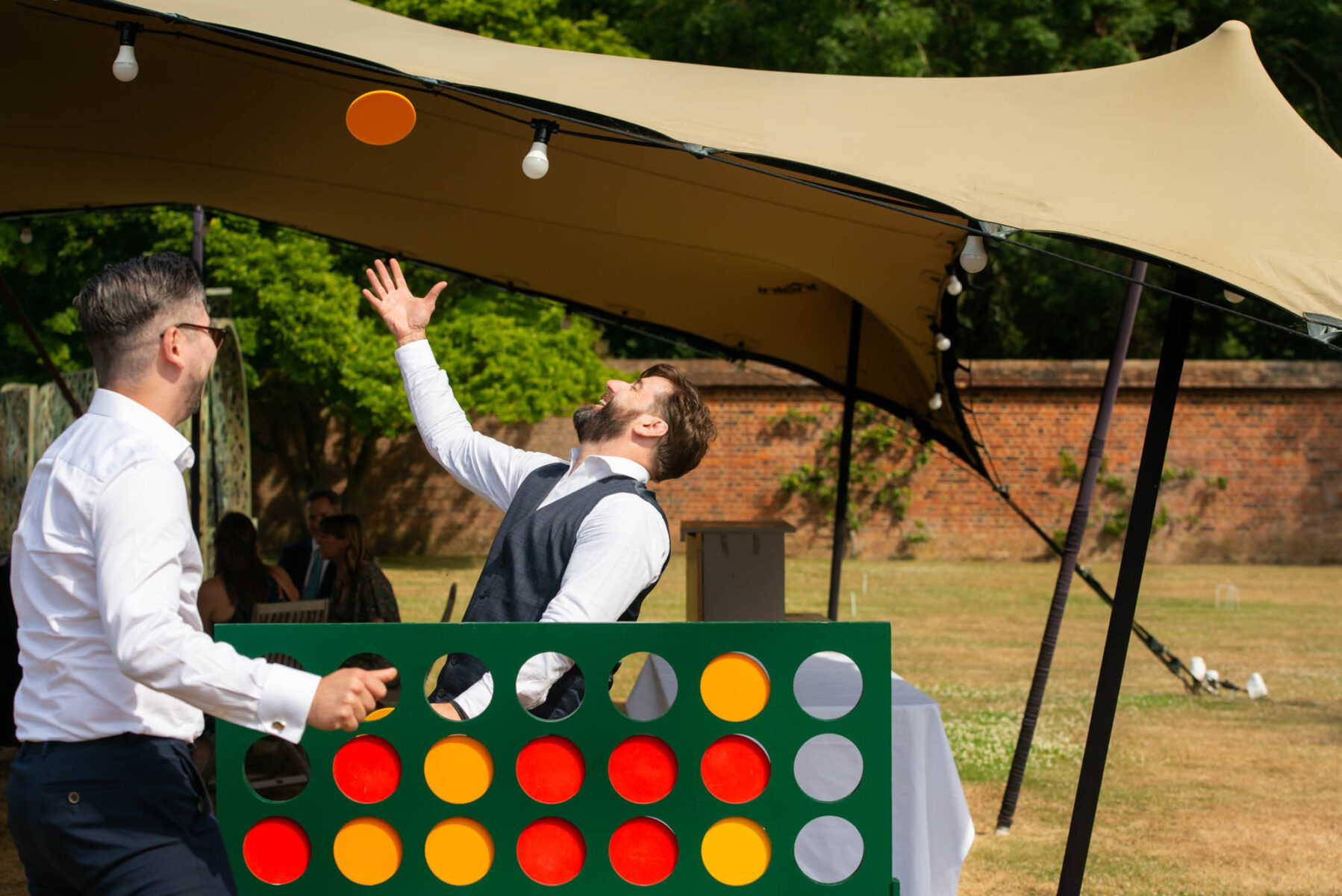 Wedding guests playing oversized connect 4