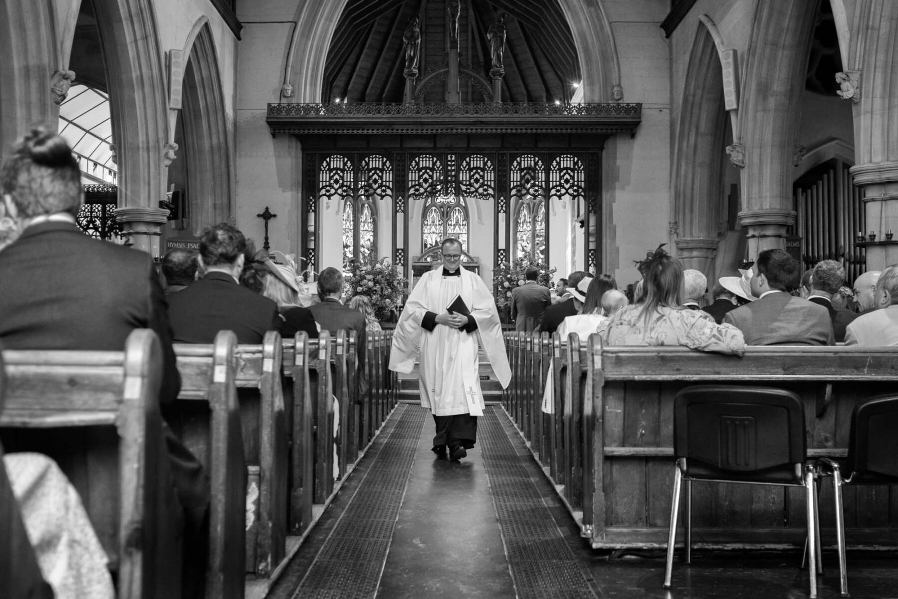 Vicar walking up the isle at St Mary's Weybridge