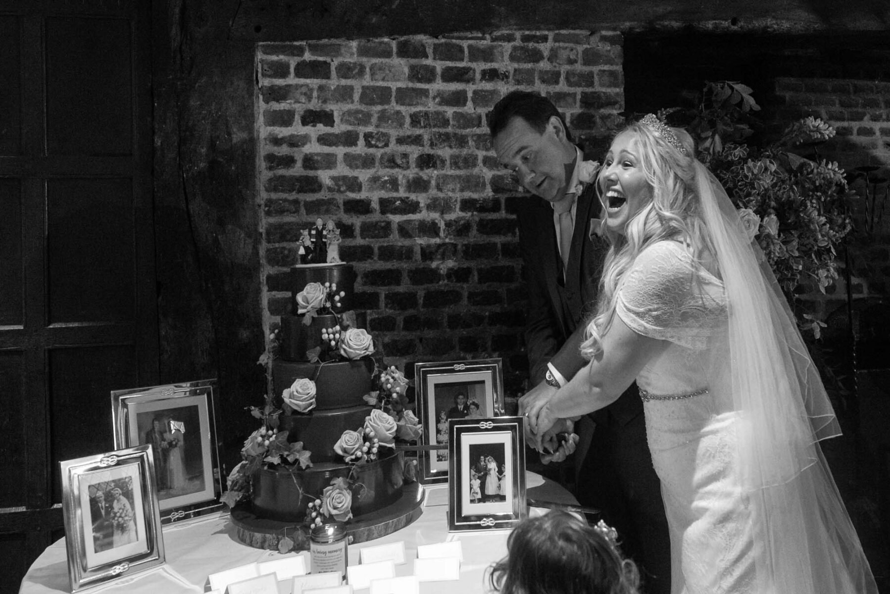 Couple cutting cake at Great Fosters