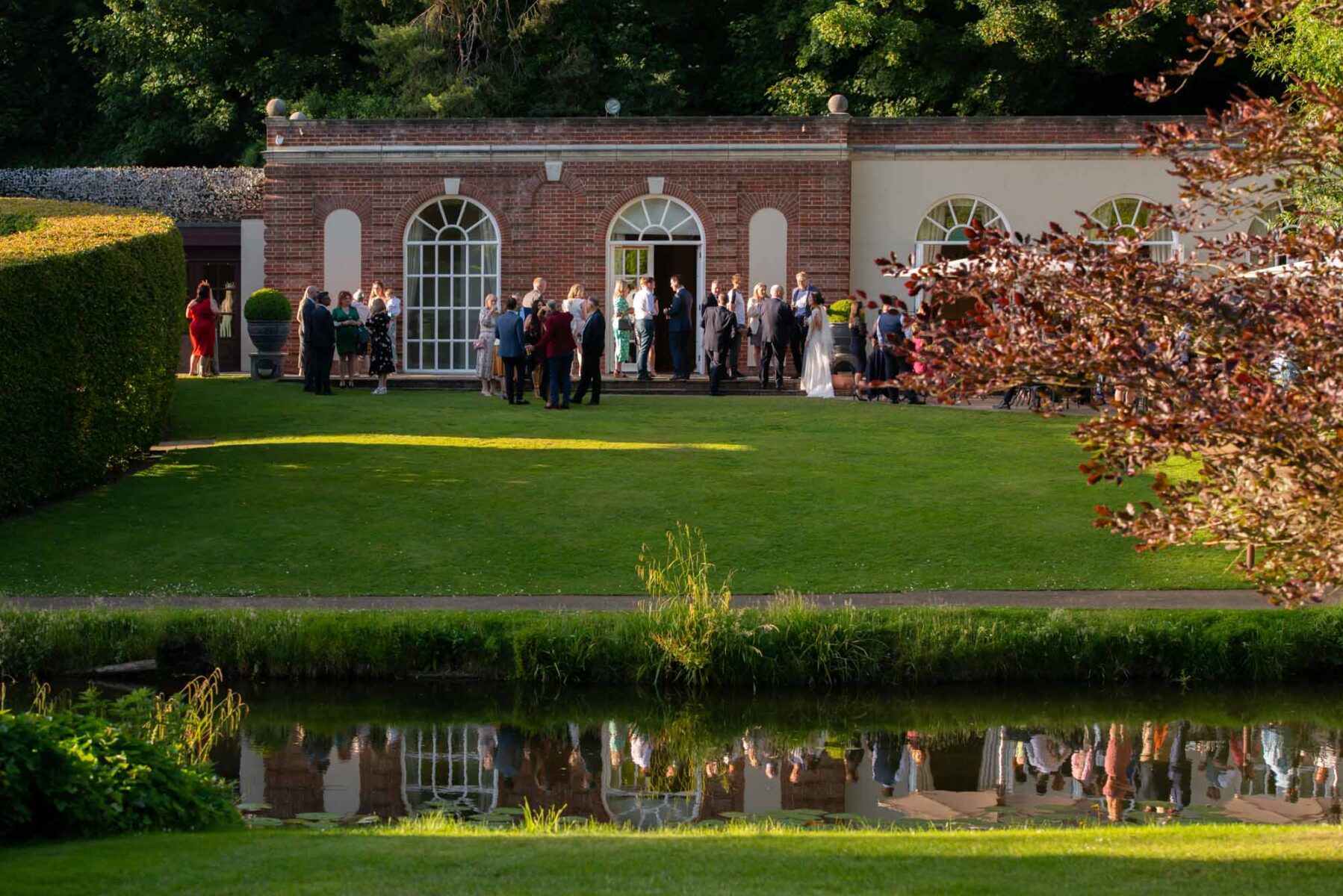 Wedding guests outdoors at the Orangery Maidstone
