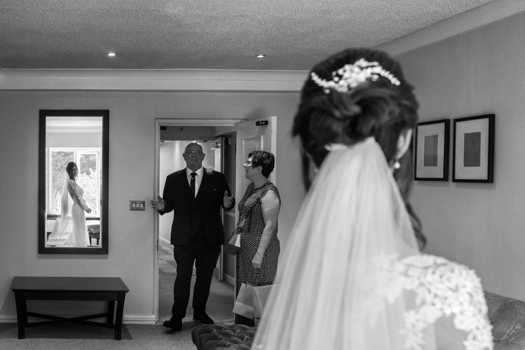 Father seeing bride in wedding dress for the first time by Orangery Maidstone wedding photographer James Robertshaw