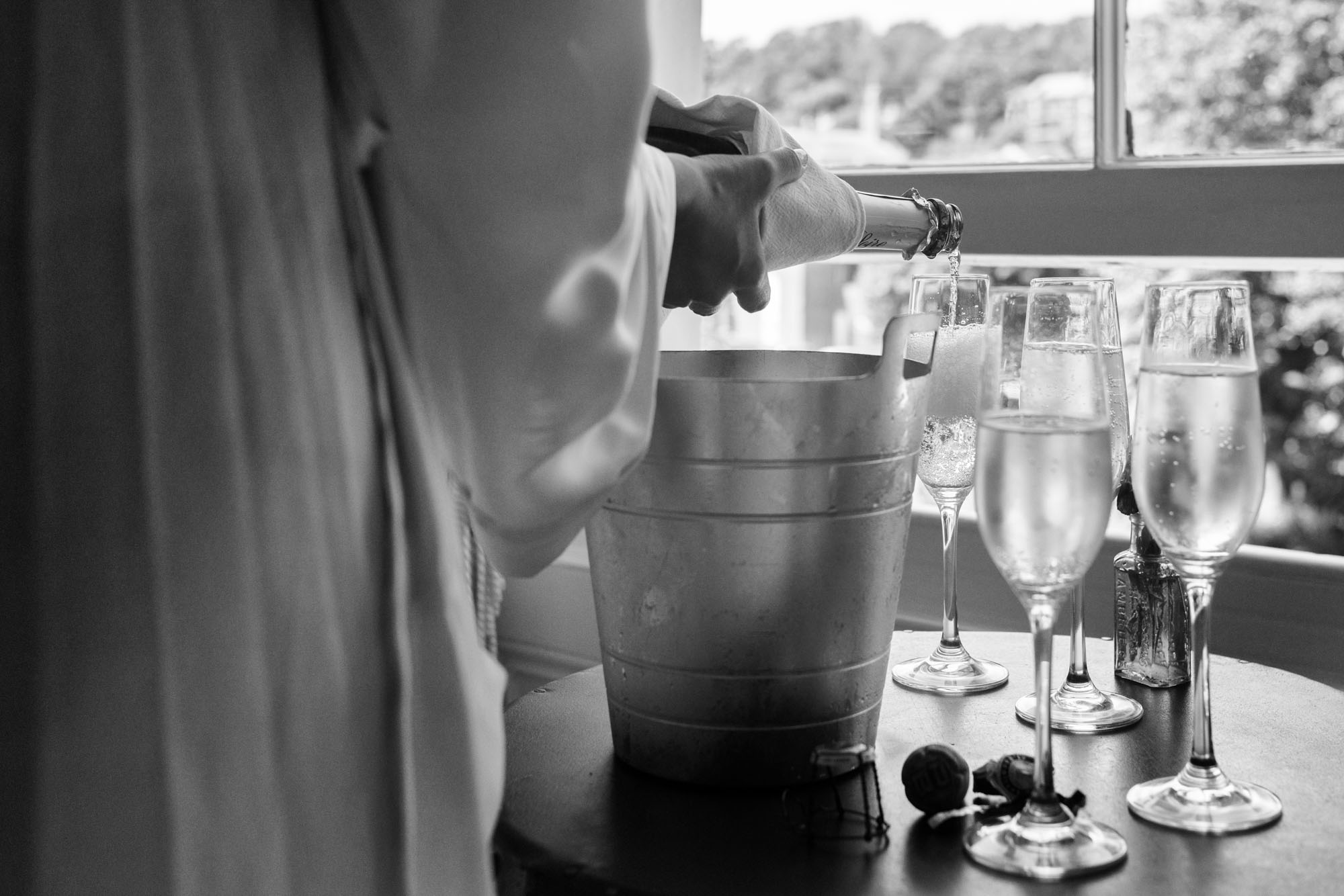 Bride pouring champagne